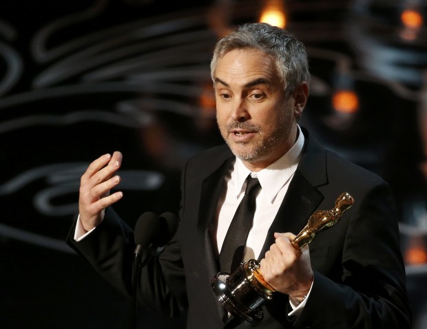 Alfonso Cuaron agradece o prêmio de melhor diretor, por "Gravidade" | Lucy Nicholson/Reuters